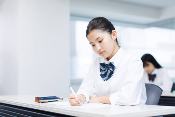 istock Asian teenagers in high school uniform studying in class 2197332540