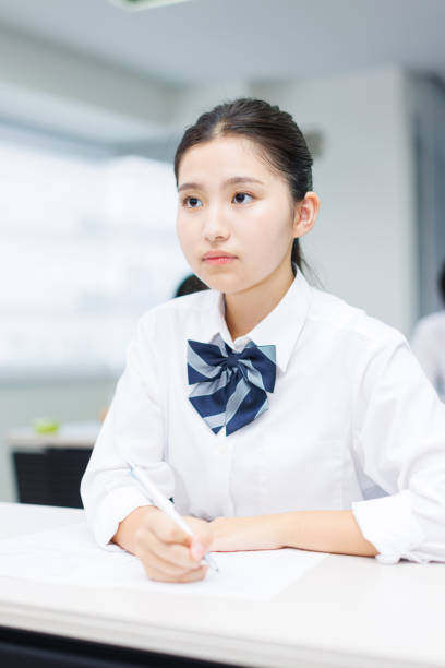 istock Asian teenagers in high school uniform studying in class 2197332542