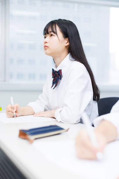 istock Asian teenagers in high school uniform studying in class 2197332549