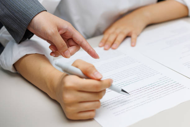 istock Teacher guiding student on the homework 2197332553