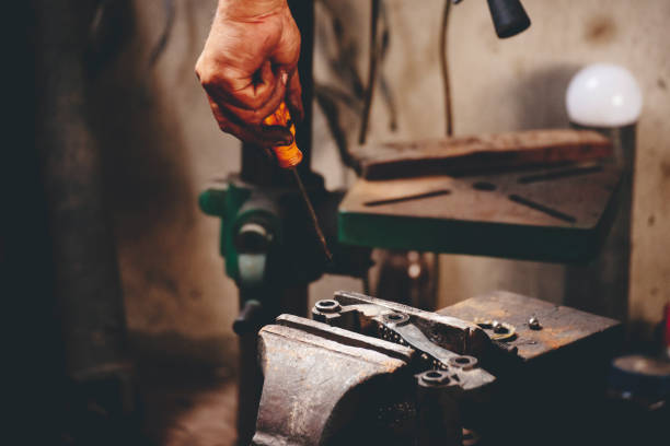 istock Mechanic Men hands use grinder Welding Hot flame metal work cutting fire iron workshop. Repairman Welder Locksmith use machine cut metal. Construction Worker hand Welding machinery iron metal grinder 2197333162