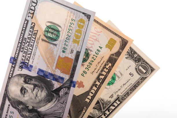 istock Banknotes in denominations of 1, 10 and 100 US dollars on a white background 2197333670