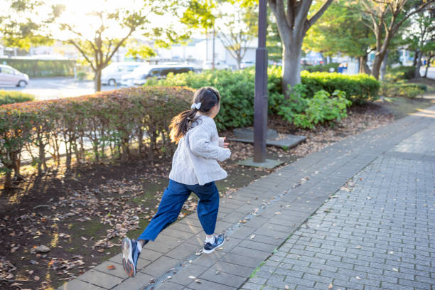 Little girls running in public park