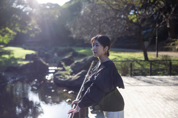 Woman looking at view in public park