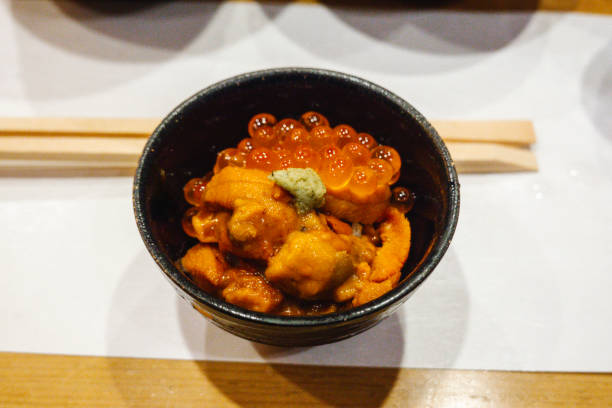 A mini rice bowl with sea urchin and salmon roe.