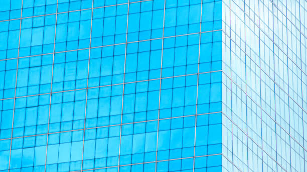 istock Crystal Clear Facade  A Minimalist Grid Design with Reflective Blue Glass, Perfect for Architectural Presentations, Modern Design Projects, or Innovative Branding 2197335688