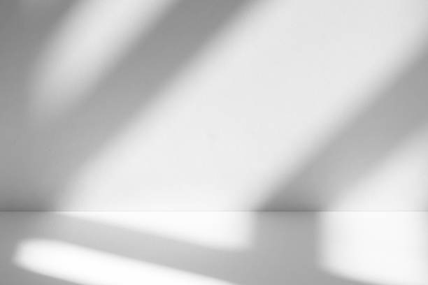 istock Wall interior background, studio and backdrops show products.with shadow from window color white . background for text insertion and presentation product 2197336631