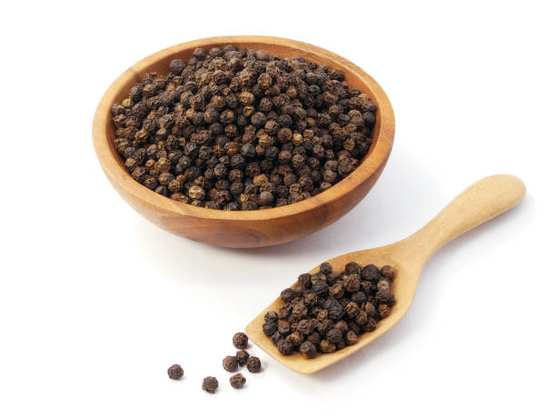 istock Black pepper in wooden spoon with bowl isolated on white background 2197337632