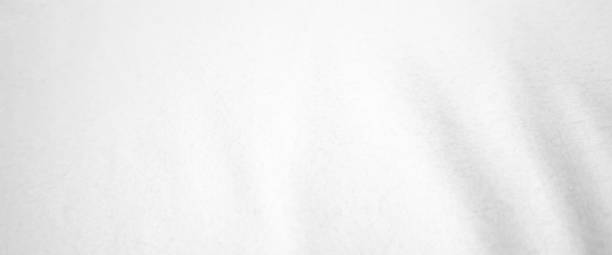 istock White wave fabric on isolated. Abstract curved silk background and copy space. 2197344004