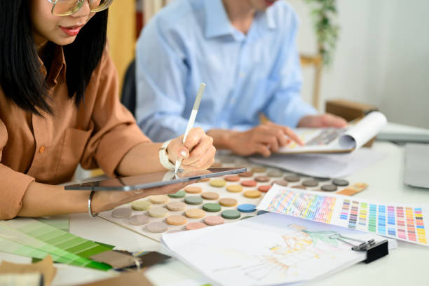 istock Two creative designers reviewing color schemes and material samples for a project 2197345050