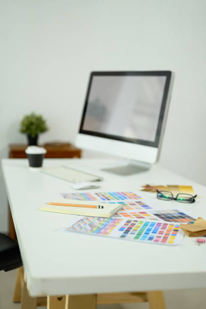 istock Creative designer workspace with computer monitor, color swatches and material sample 2197345058
