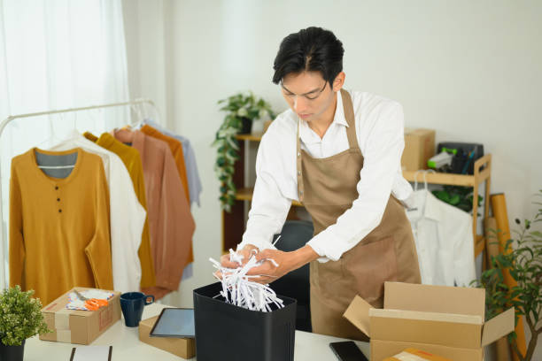 istock Small business owner preparing a parcel for delivery 2197345802