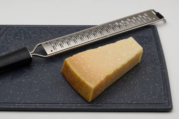 Parmigiano Reggiano cheese wedge ready to be grated.