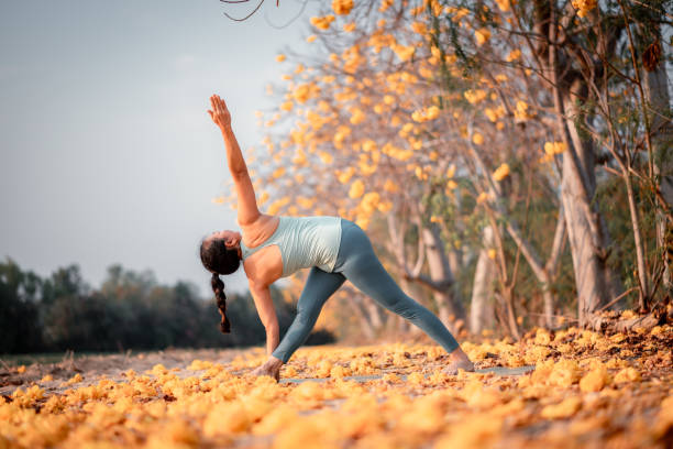 istock Woman practicing an advanced yoga pose outdoors in a picturesque autumnal setting  tranquil and inspiring scene conveys a sense of mindfulness, connection with nature, and the pursuit of physical and mental harmony. 2197346230