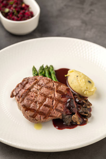 istock Grilled beef steak with red wine sauce, mashed potatoes, and asparagus 2197347031