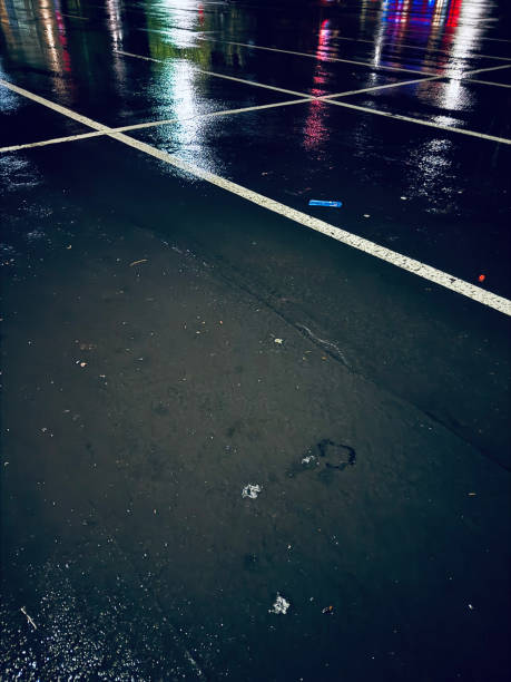 istock parking lot at night in the rain 2197348422