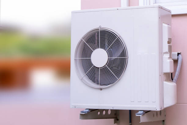 istock Outdoor split wall type air conditioner compressor unit A/C inverter installed on the outside of the building. 2197350968