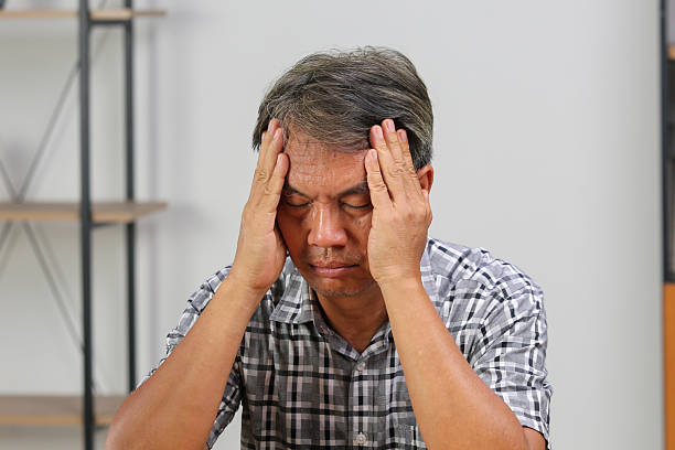 istock Asian senior man is having a headache. 2197352105