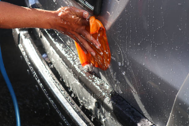 istock Washing car with orange cloth 2197354454