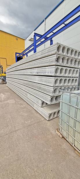 istock Stacked concrete slabs at an industrial site under a cloudy sky 2197356435