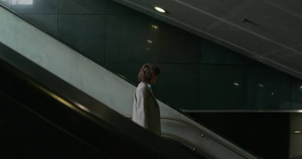 istock A woman goes down to the subway 2197357001
