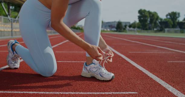 istock A woman ties her shoelaces 2197358619