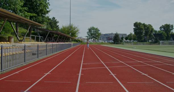 istock A woman runs in the stadium 2197358642