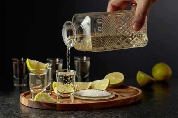 istock Gold tequila with salt and lime slices. 2197358735