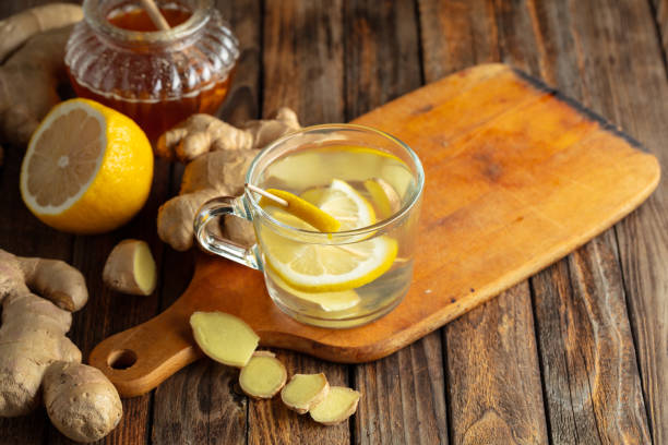 istock Ginger tea with lemon and honey on a old wooden table. 2197358758