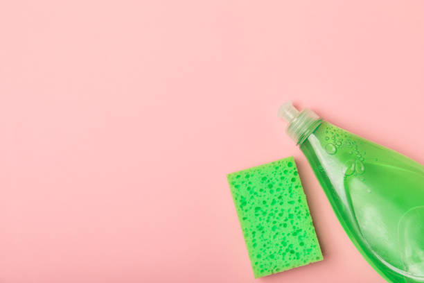 istock Colorful dish sponges on textured background. Kitchen sponge. Cleaning concept, cleaning service. Dishwashing liquid with clean and dirty dishes plate. Place for text, copy space. Wash the dishes. 2197359565