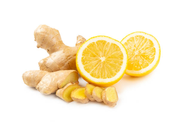 istock Fresh ginger and lemon isolated on white background. Sliced ​​ginger. Ginger root. Traditional alternative medicine, healing tea for immunity. Close-up. 2197360625
