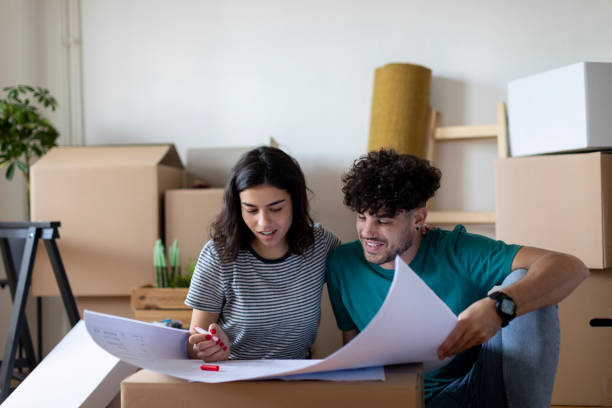 istock Young couple planning home decor in new house 2197361921