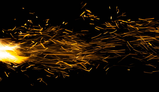 istock sparks from the fire glowing in the dark 2197362430