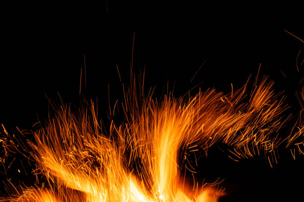 istock sparks from the fire glowing in the dark 2197362460