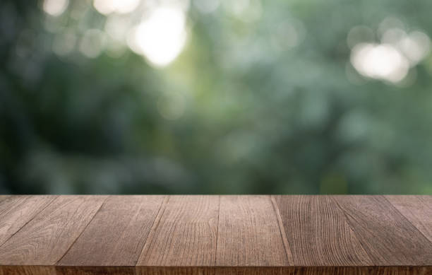 istock Empty wood table top and blur of restaurant background selective focus product display 2197362572