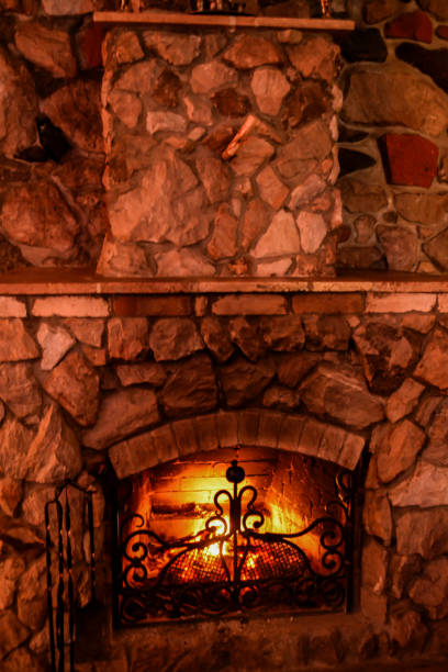 istock Fireplace with beautiful texture for home interior. Fireplace in the house. Burning fireplace. Fire design 2197363203