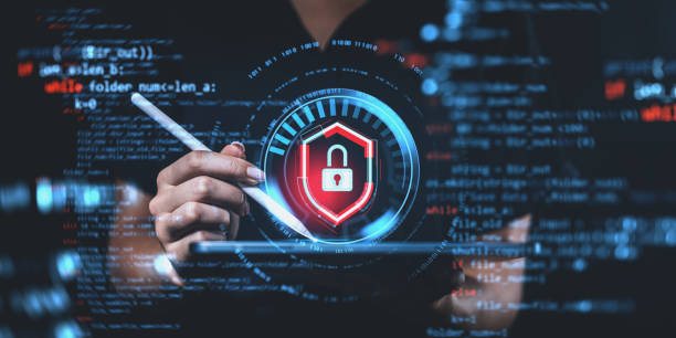 istock Hand holding stylus with digital lock symbol in front of code on dark background. 2197363787