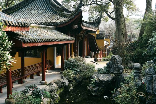istock A traditional Chinese architecture with ornate roofs and a serene garden setting. 2197364000