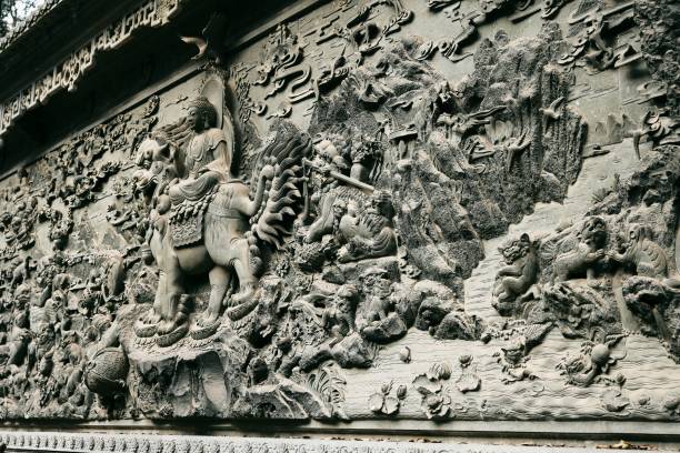 istock Intricate stone relief depicting a historical scene with mythical figures and animals. 2197364010