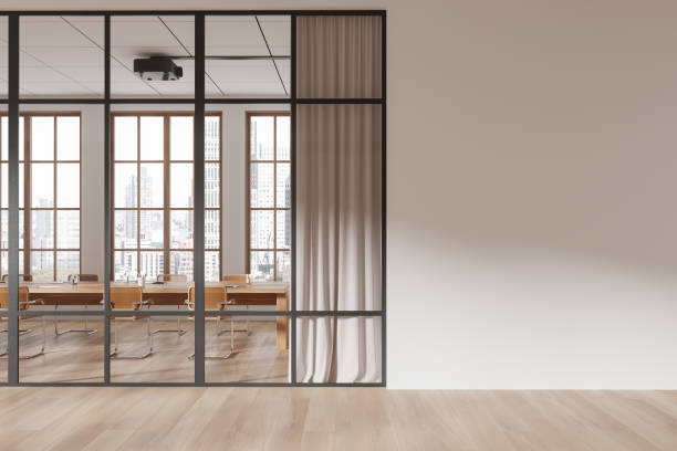 istock Modern office interior with glass partition, wooden flooring, and blank white wall for customizable design template or mockup. 3D Rendering 2197364779