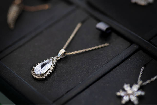 istock Elegant silver necklace with clear gemstone close-up 2197367846