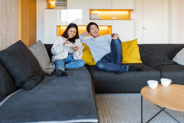 istock Happy Japanese Couple Relaxing at Home 2197371532