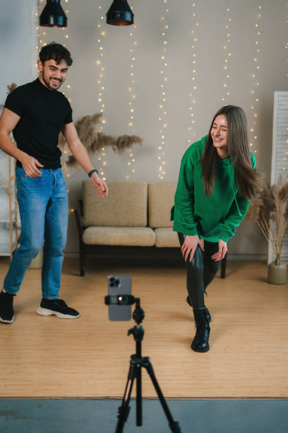 istock A Creative Duo Enthusiastically Capturing Fun and Memorable Moments on Camera Together 2197371844