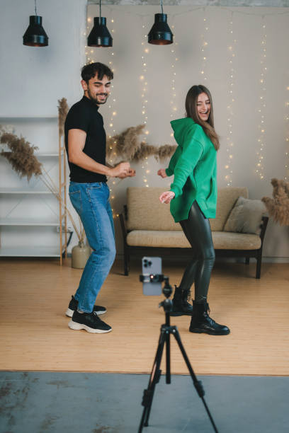 istock A dynamic dance duo films an energetic performance in a cozy studio, showcasing their choreography 2197371902