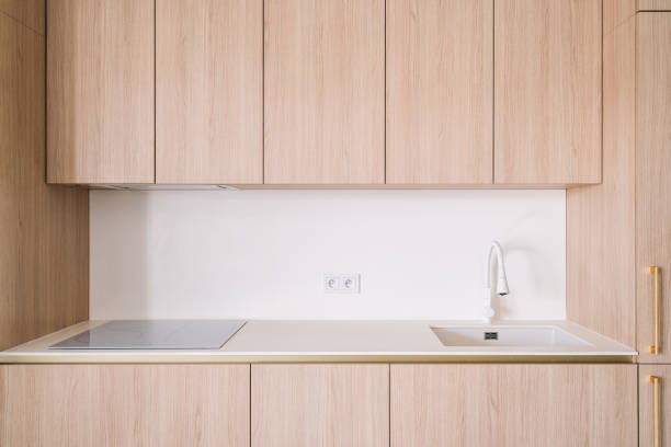istock Modern kitchen with minimalist design featuring induction hob and sleek cabinetry 2197378848