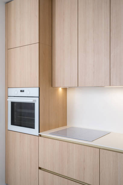 istock Modern kitchen with induction hob and integrated oven in minimalist design 2197378895