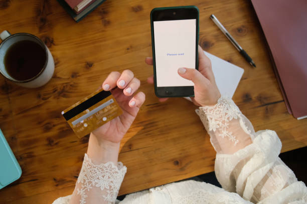istock Hands using smartphone and credit card to make online payment. 2197379656