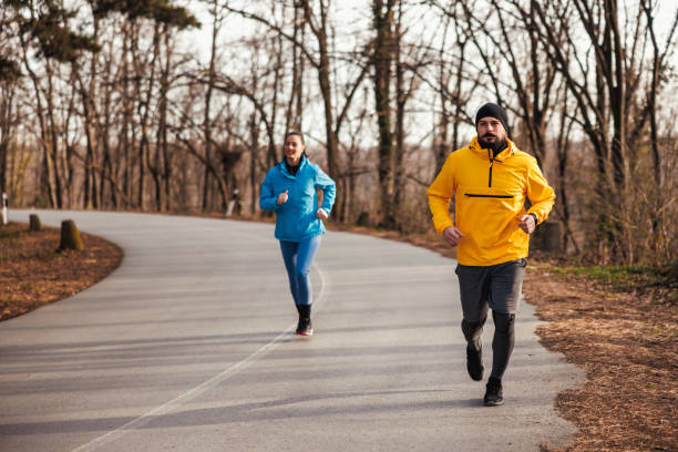 istock Couple running in nature 2197379956
