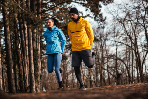 istock Active couple warming up for morning run in nature 2197380655