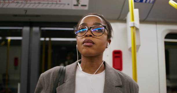 istock A woman on a subway train 2197382105